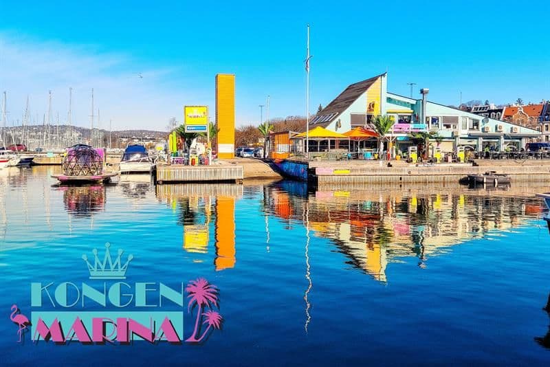 Exterior of restaurant with outdoor seating by the sea